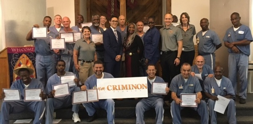 Inmates at a Florida Correctional Institution proudly display their certificates after completing a course towards the re-attainment of their self-respect